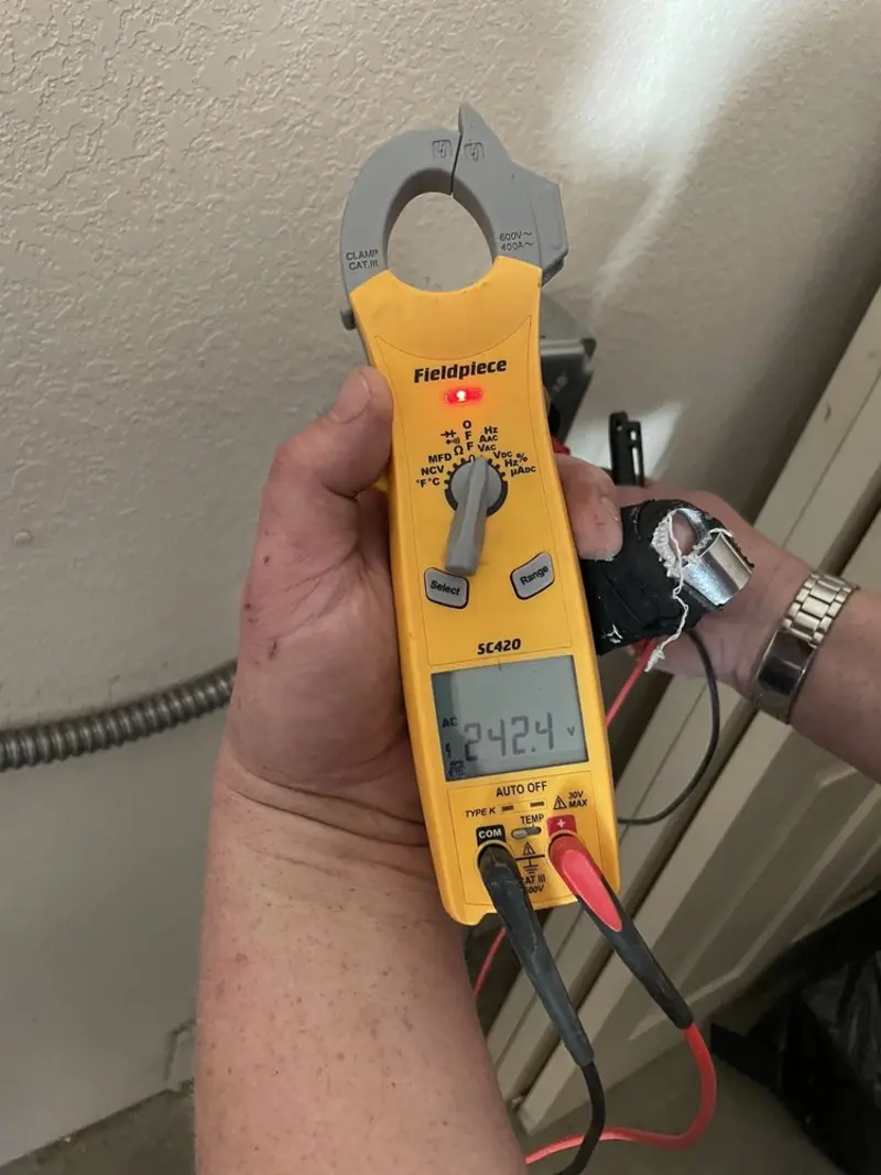 Voltage testing with clamp meter during Outlet Installation in Camden